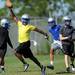 A Lincoln player celebrates a play during practice at the school on Wednesday, August 14, 2013. Melanie Maxwell | AnnArbor.com